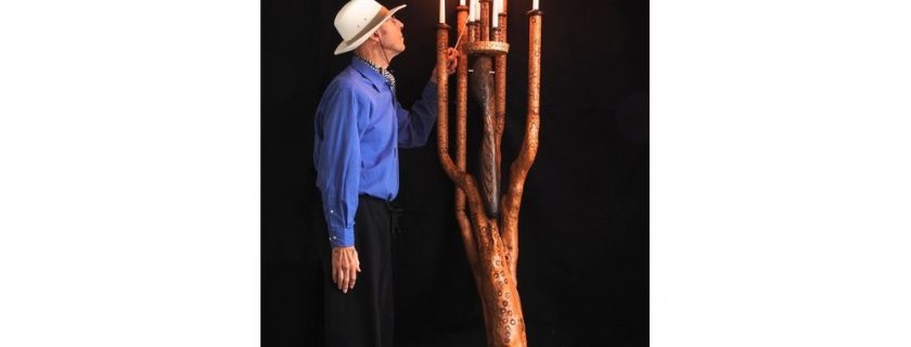 CANDELABRA – Colin lighting the 9th candle of his Candelabra